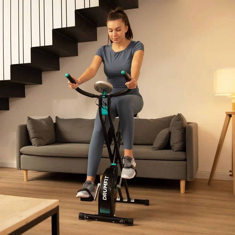 Cecotec Bicicleta estática plegable DrumFit X-Bike Neo, Sillín y manillar lateral, Sistema de plegado fácil y compacto, Soporte para dispositivos, 8 niveles de resistencia, 1,5 Kg volante de inercia.