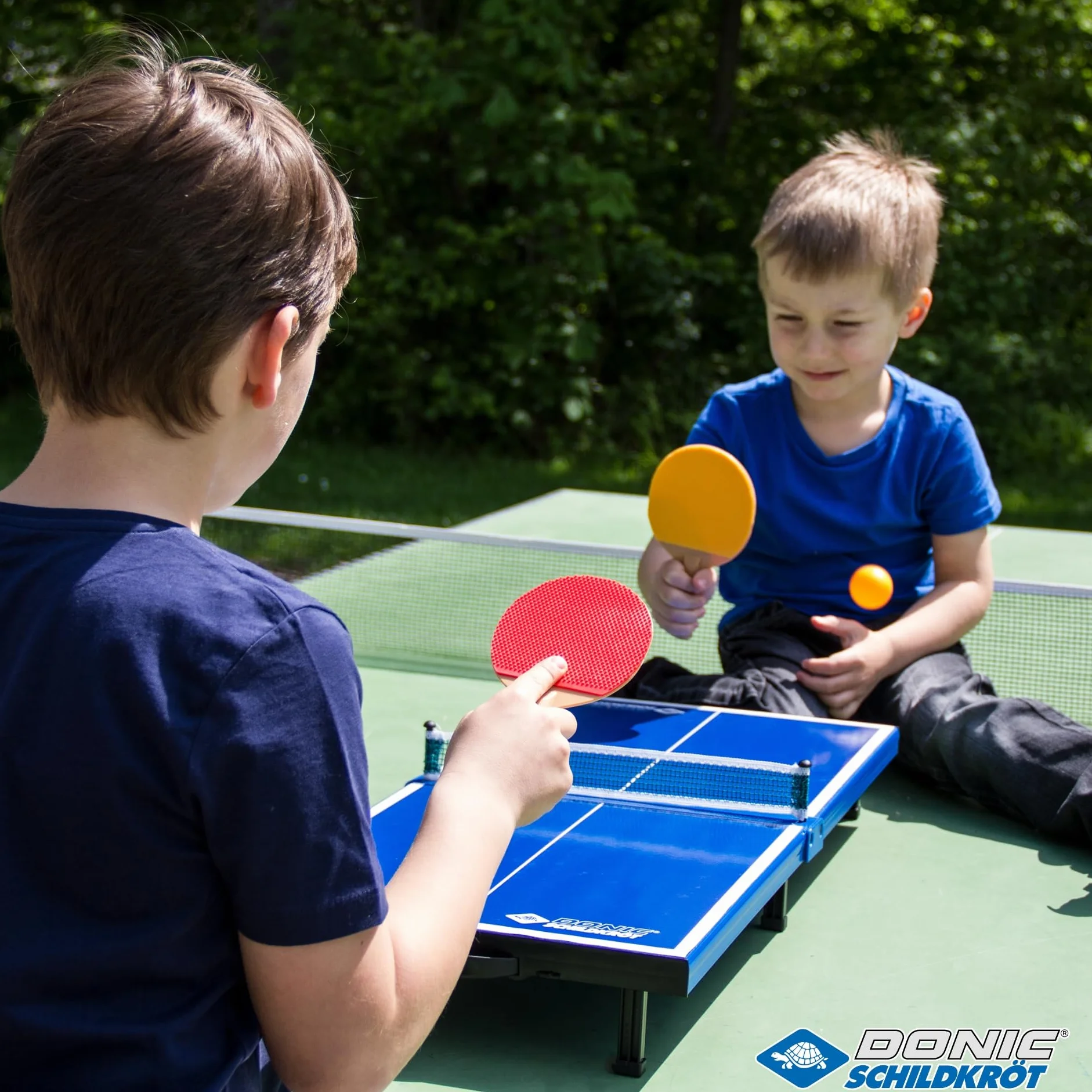 Donic-Schildkröt 838576 - Juego Completo de Mesa de Ping Pong (2 Palas y 1 Pelota, Plegable, tamaño maletín, 68 x 33 x 9 cm), Color Azul