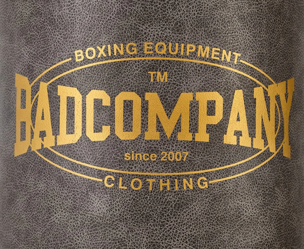 Bad Company Saco de boxeo vintage con cadena de acero de 4 puntos y anillo de metal, piel sintética, relleno o sin rellenar, 80/100/120/150/180 x 35 cm