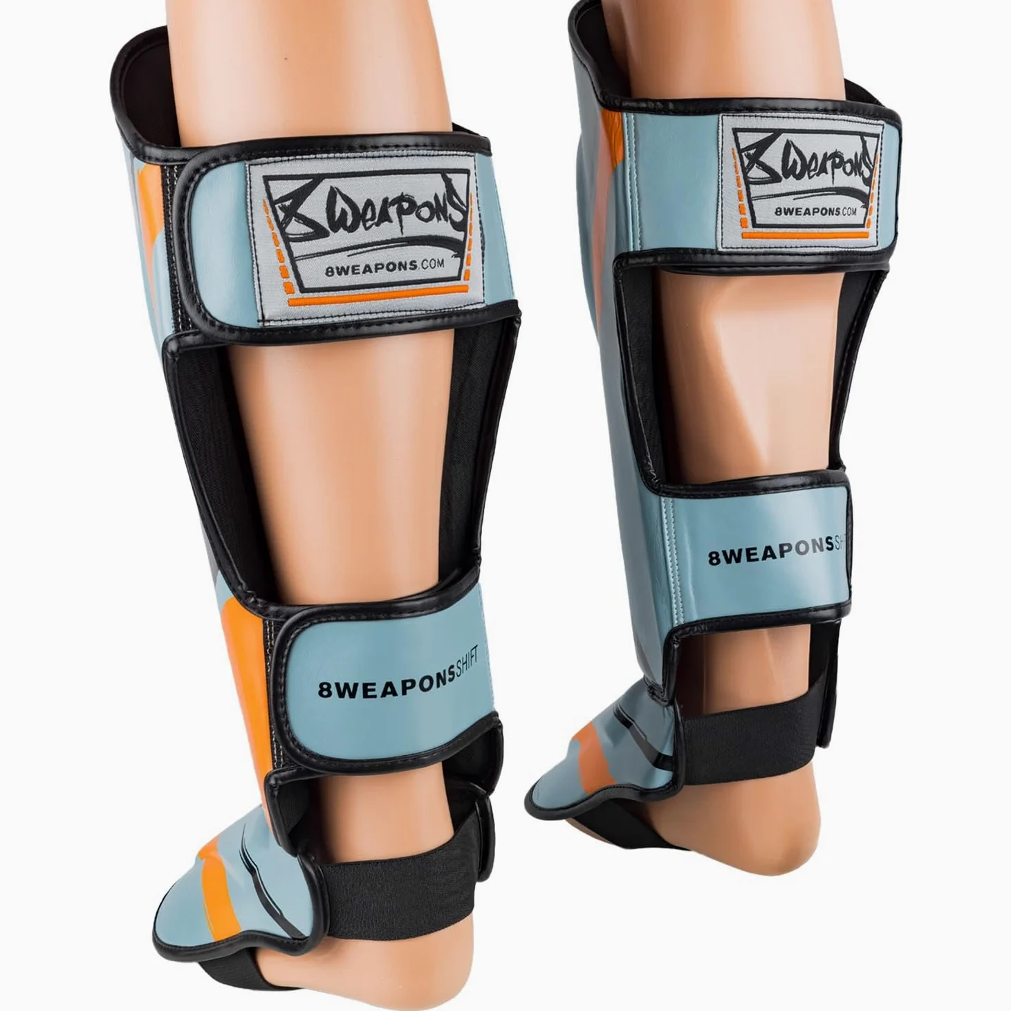 8 WEAPONS Espinilleras Shift, color gris hielo naranja, entrenamiento y competición, piel sintética de alta calidad y amortiguación perfecta, Muay Thai, K1, MMA, karate y kickboxing