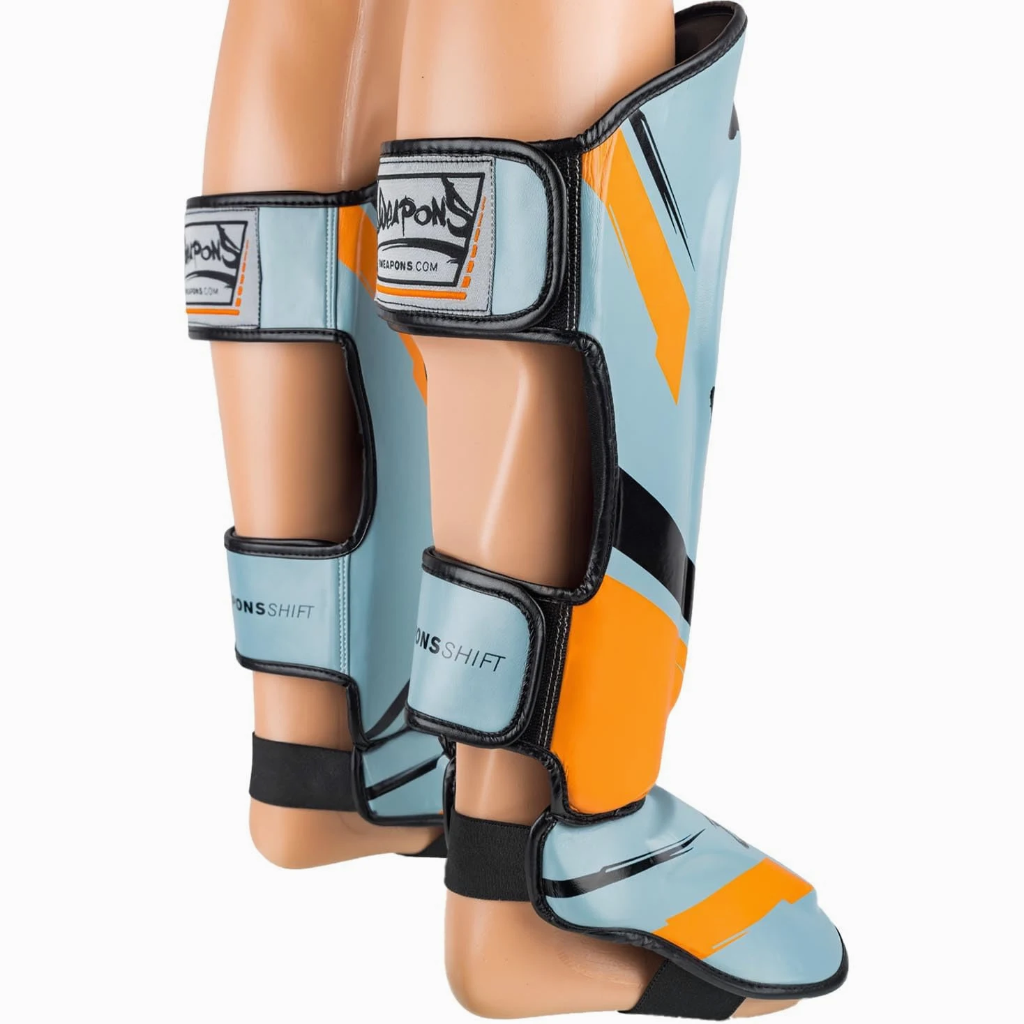 8 WEAPONS Espinilleras Shift, color gris hielo naranja, entrenamiento y competición, piel sintética de alta calidad y amortiguación perfecta, Muay Thai, K1, MMA, karate y kickboxing