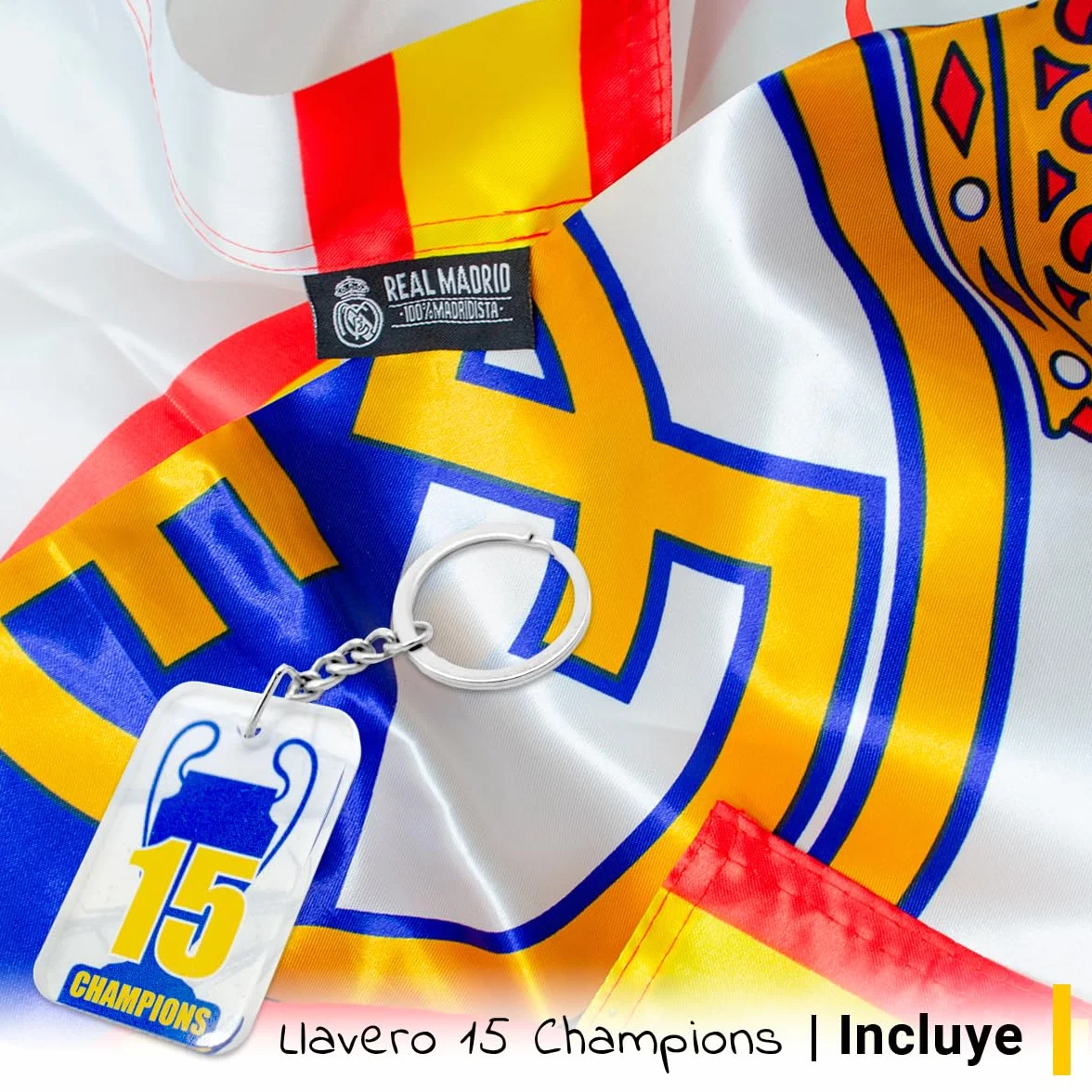 Bandera oficial del Real Madrid Club de Fútbol + Llavero 15 Champios | 150 x 100 cm - Escudo del Real Madrid y borde con colores de España | Producto Oficial